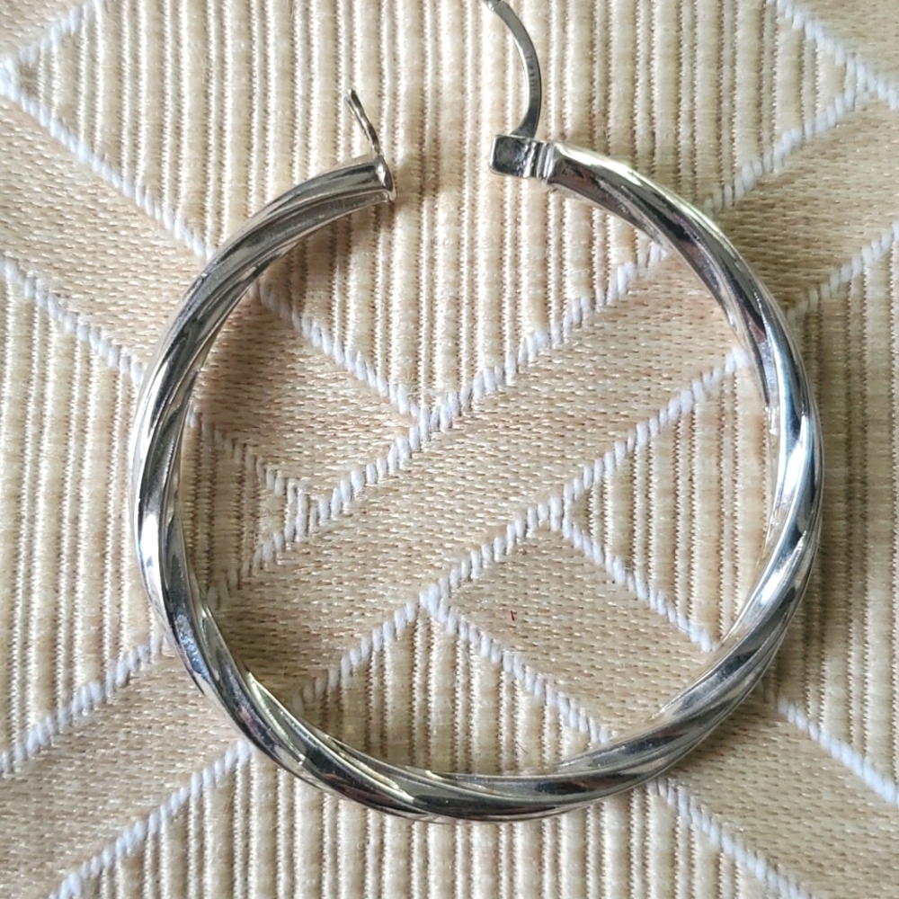 One  Italian 14 karat gold  white gold earrings from Costco .